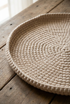 handwoven mat on a wooden surface